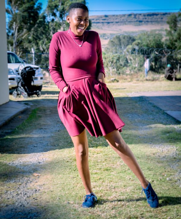 Maroon short skirt with front pockets and a matching poloneck body suit - Image 2